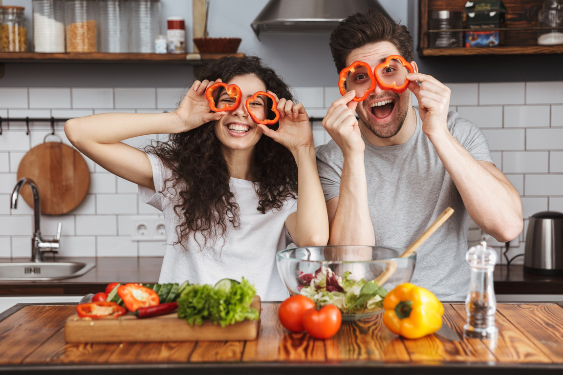 Cheerful Couple Cooking Healthy Fresh Salad